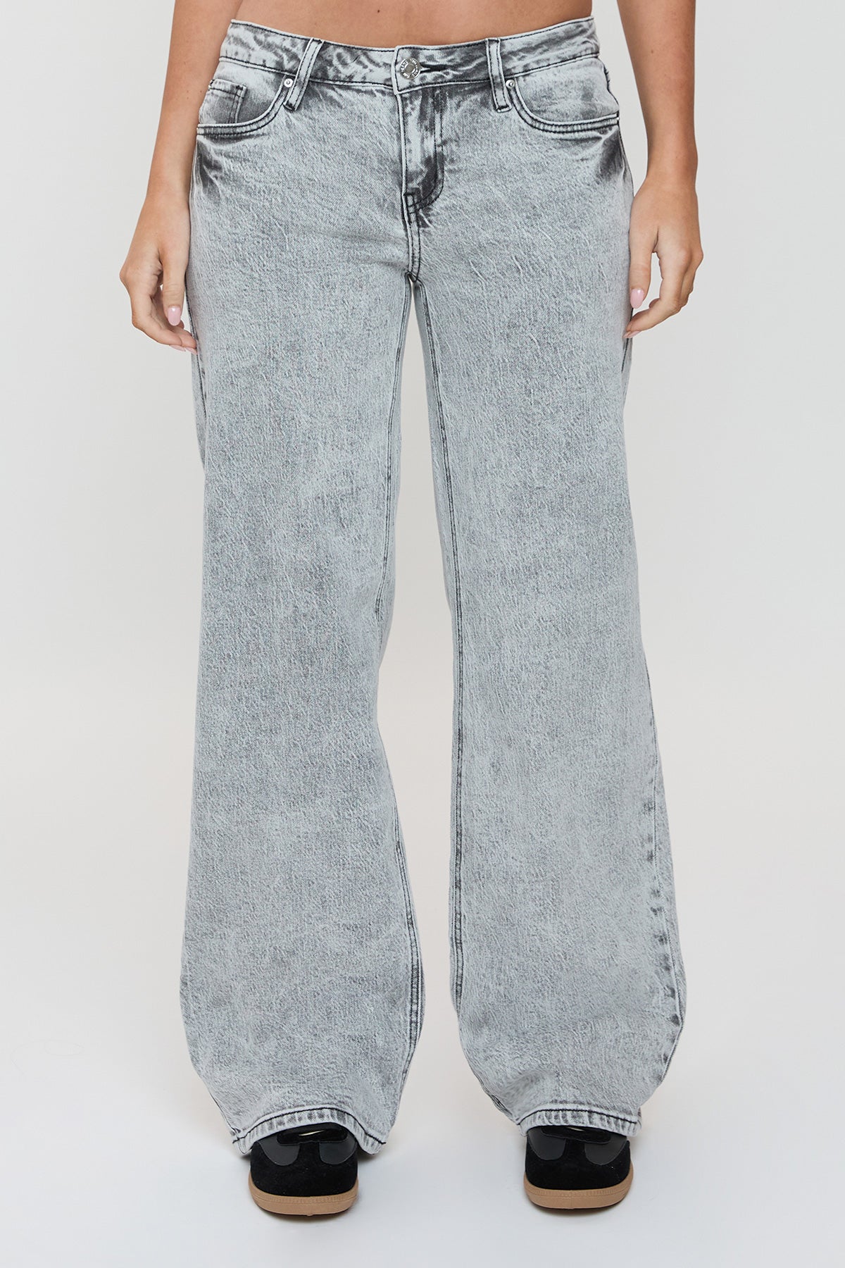 Model wearing YMI JEANS Women's Wide Leg Luxe Britney Jeans, showcasing the flattering high-rise and flowy silhouette.