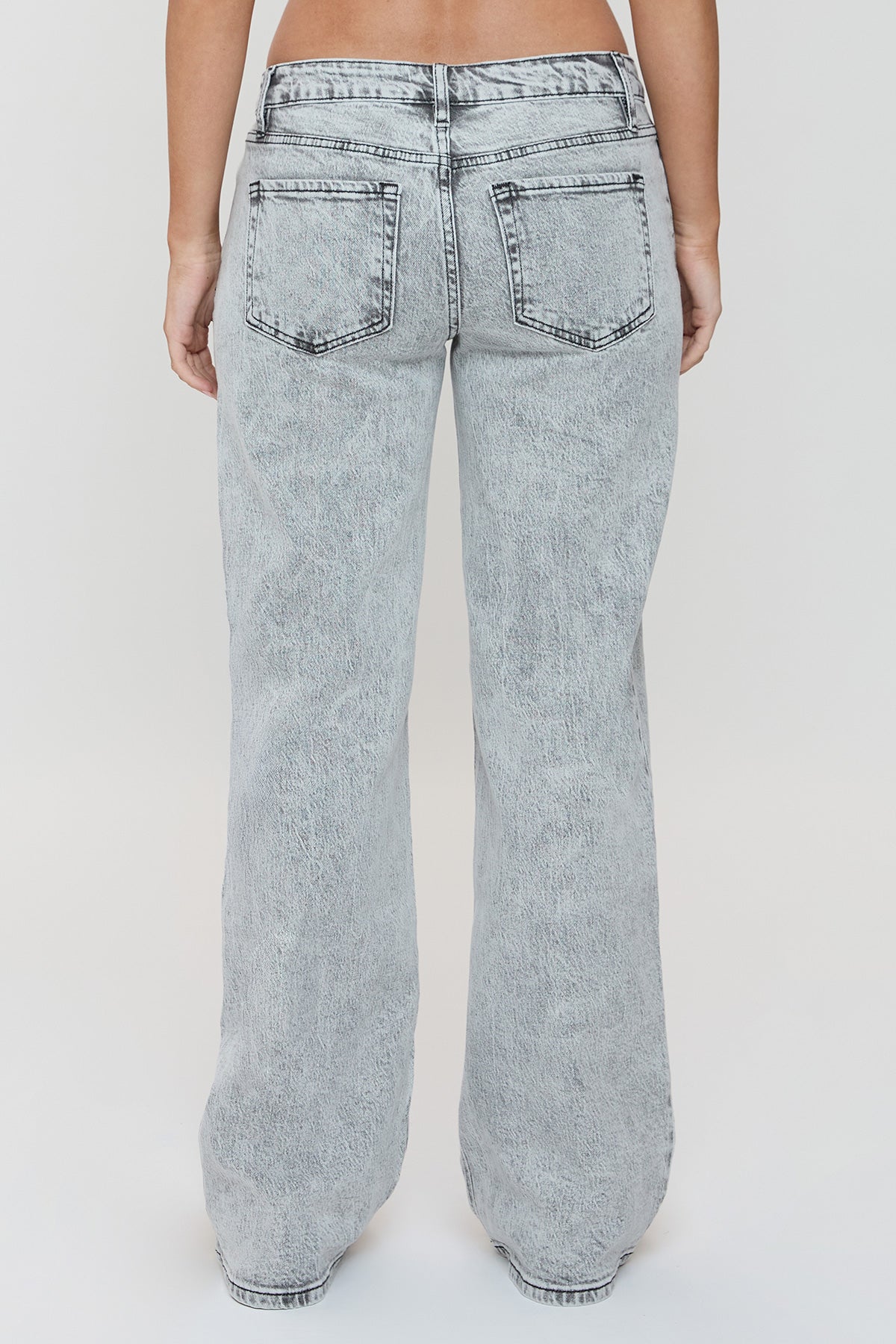 Detail shot of the wide leg opening and clean hemline of the YMI JEANS Women's Luxe Britney Jeans in light wash denim.