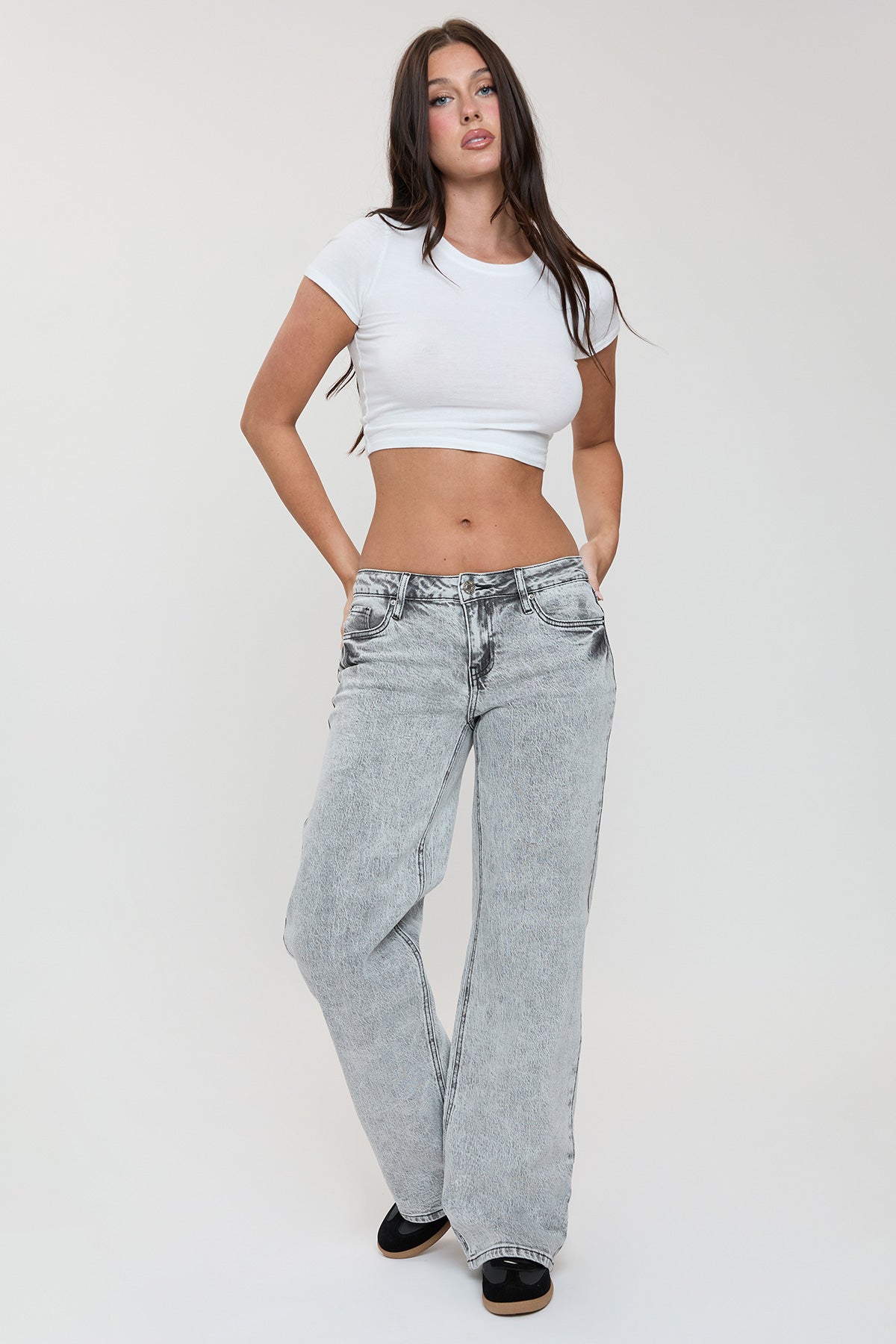 Close-up of the YMI JEANS branded button and zipper closure on the high-rise waistband of the Luxe Britney Jeans.
