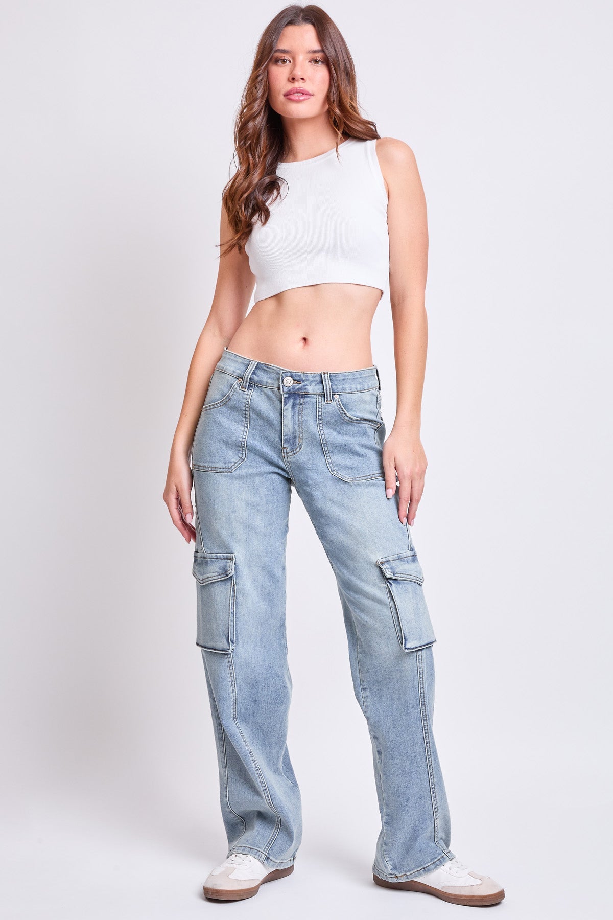Model wearing YMI JEANS Women's High Rise Skater Cargo Jeans, demonstrating the trendy casual denim style.