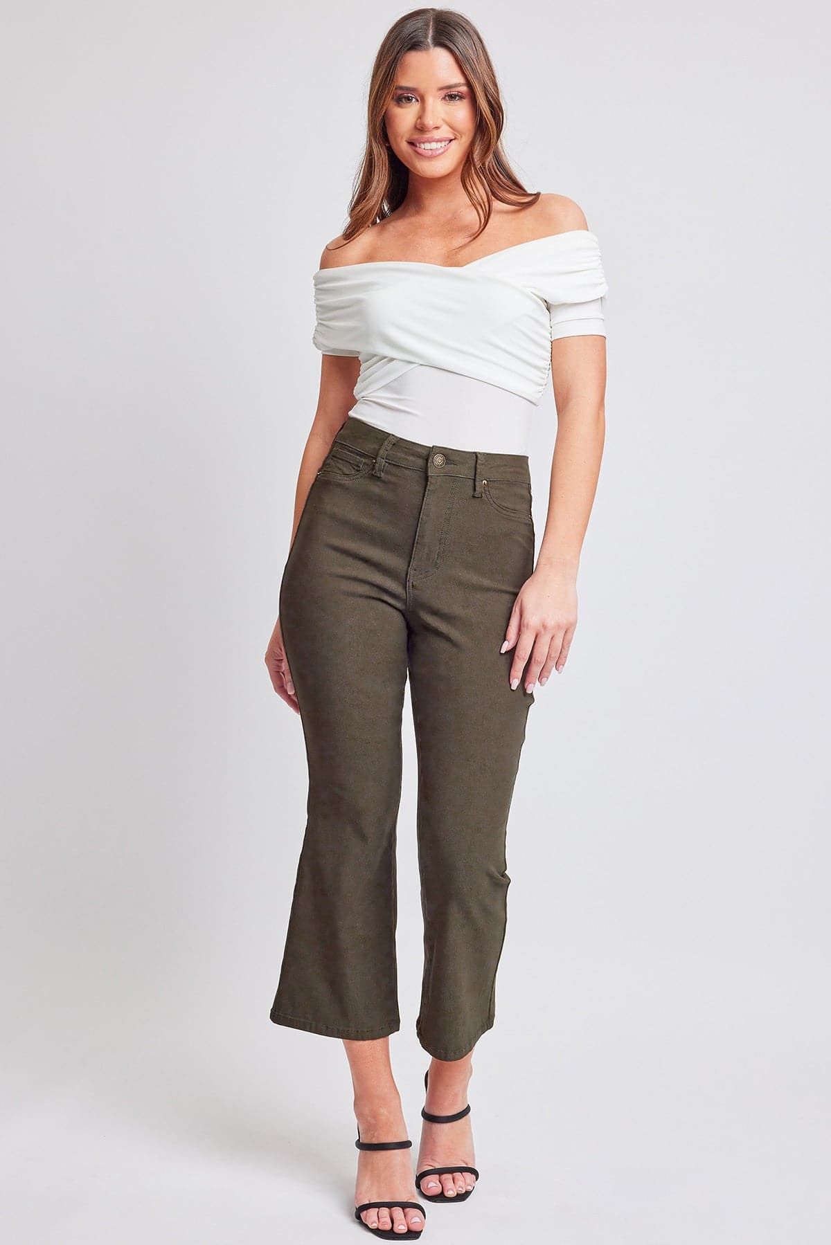 YMI JEANS Women's Hyperstretch Cropped Kick Flare Pants modeled, demonstrating their comfortable stretch and stylish kick fla