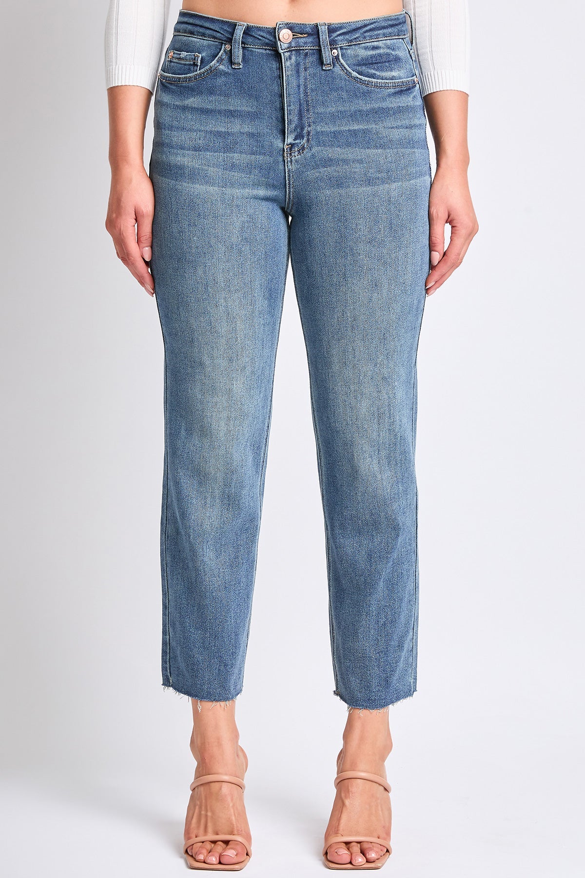 YMI JEANS Women's Cropped Straight Jeans, folded neatly, emphasizing the premium stretch denim and light blue color.