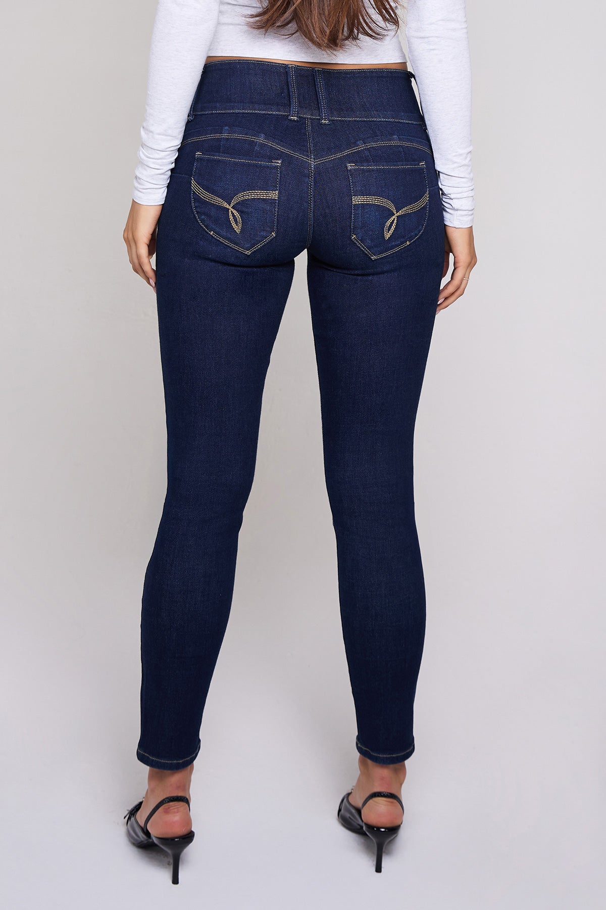 YMI JEANS Women's Mid Rise 3-Button Skinny Jeans, lower leg and ankle detail, tapered for a sleek silhouette.