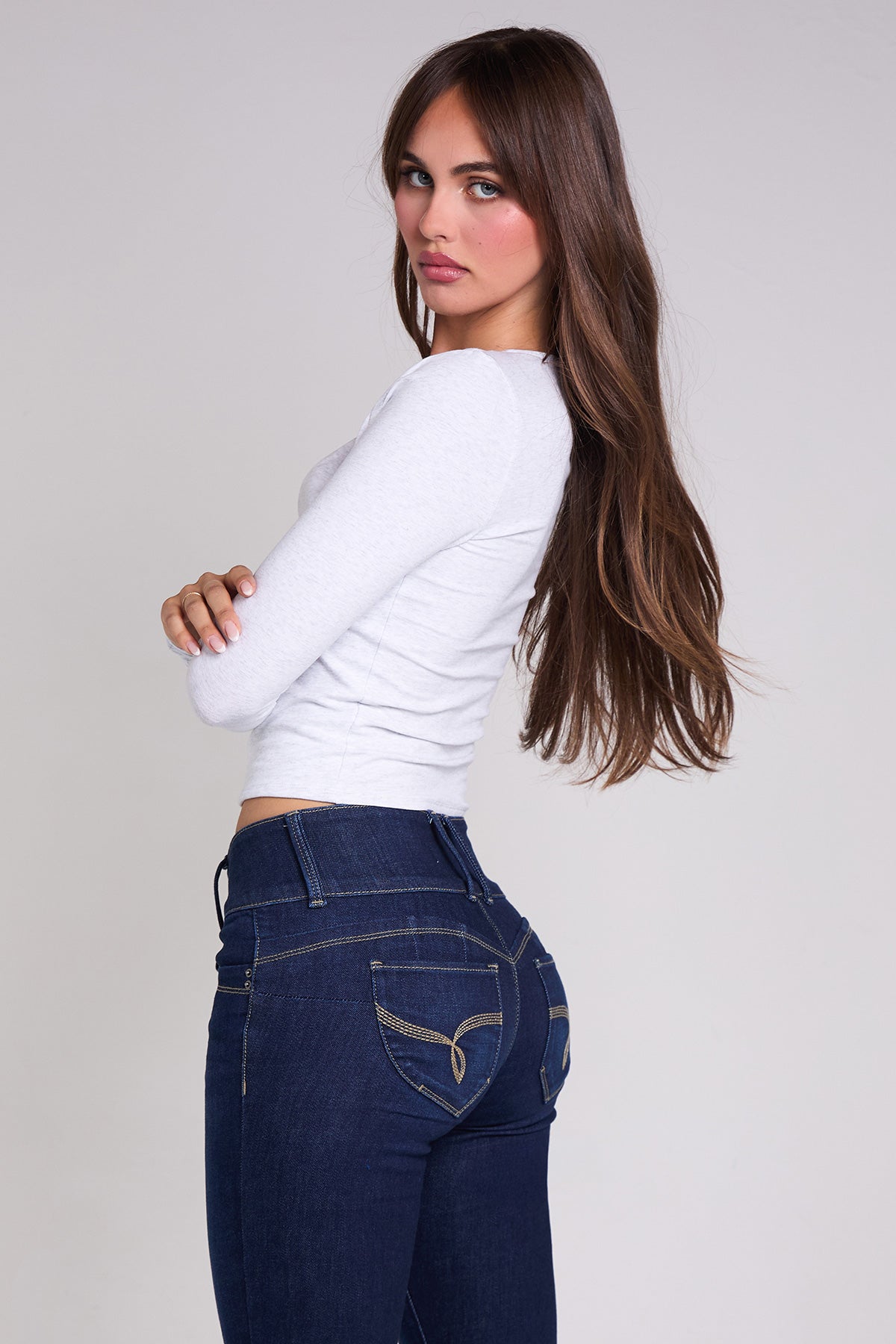 YMI JEANS luxe denim skinny jeans laid flat to show full length, stitching details, and consistent dark wash color
