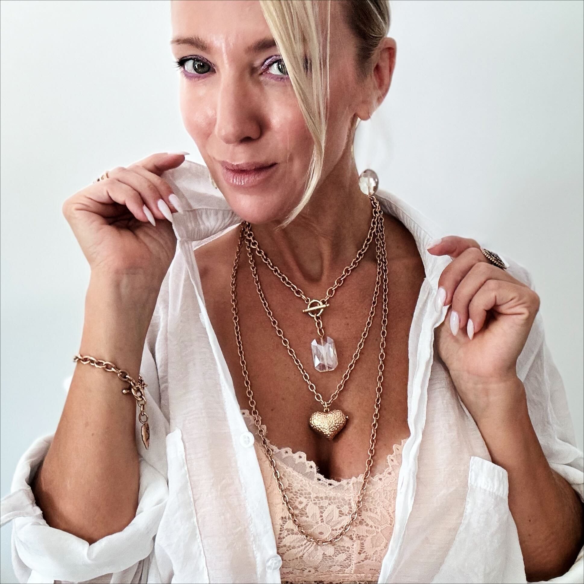 Katia Designs Follow Your Heart Locket Essential Necklace, with a close-up view of the detailed heart locket pendant.