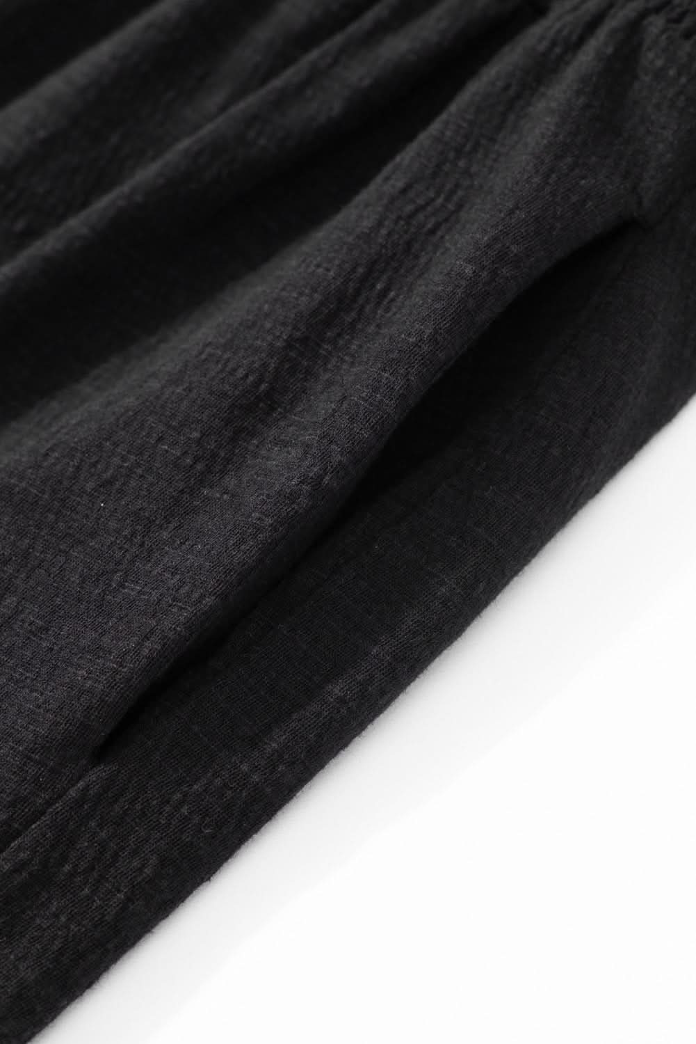 Plus size black smocked jumpsuit 