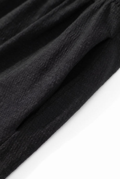 Plus size black smocked jumpsuit 