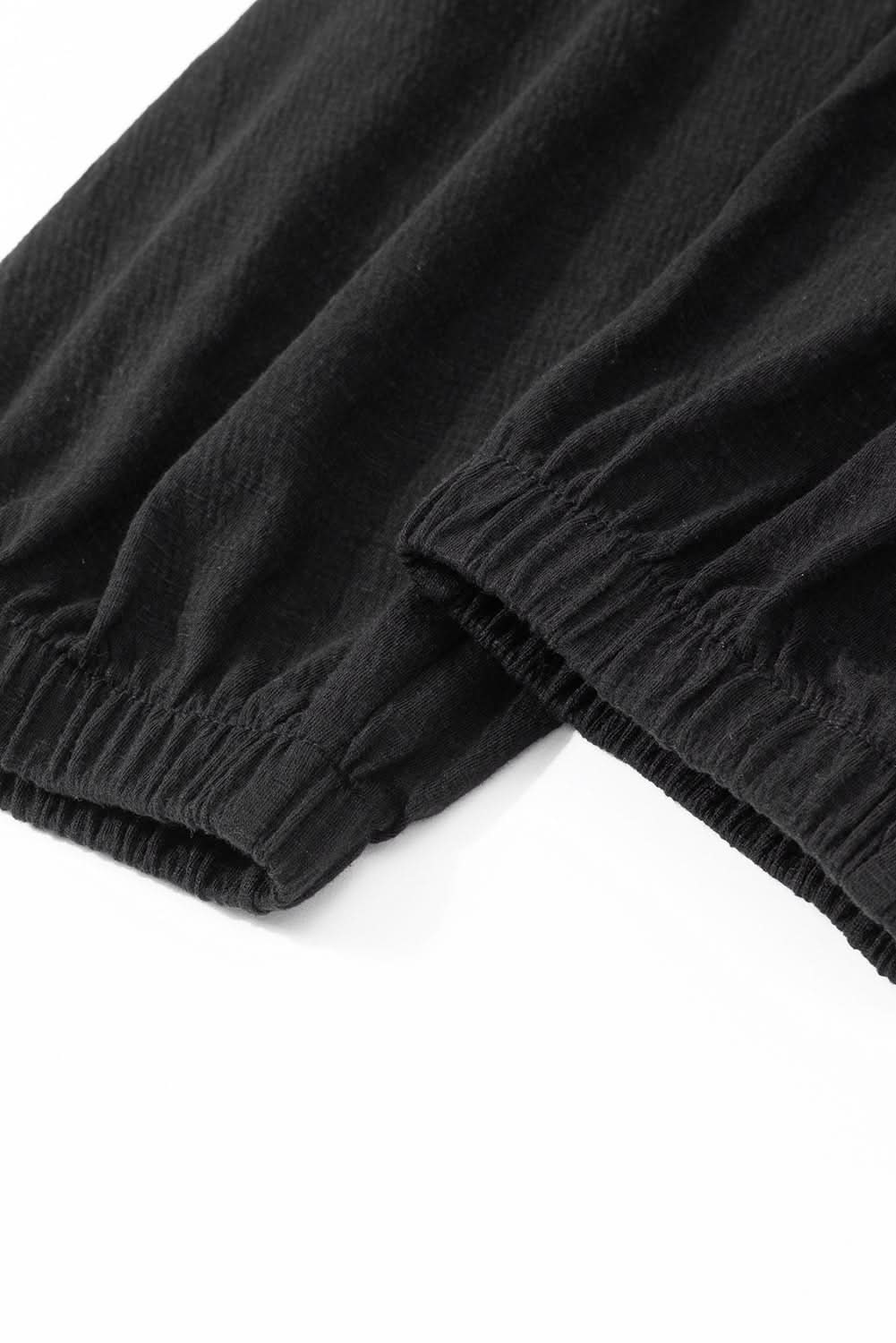 Plus size black smocked jumpsuit 