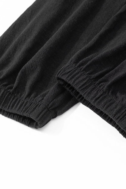 Plus size black smocked jumpsuit 