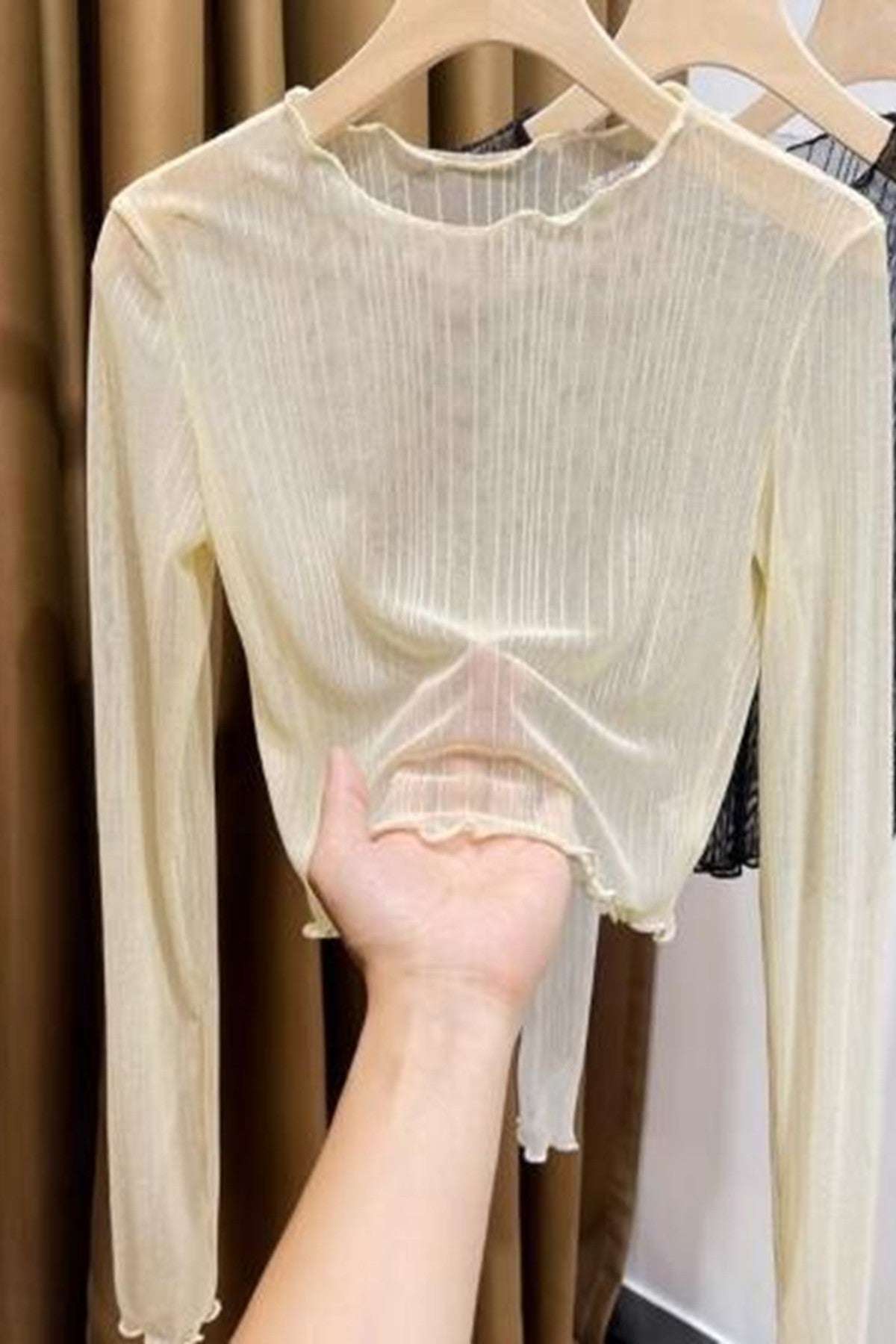 Miss Sparkling Cropped Mesh long sleeve top, showcasing its trendy sheer fabric and stylish fit for a modern look.