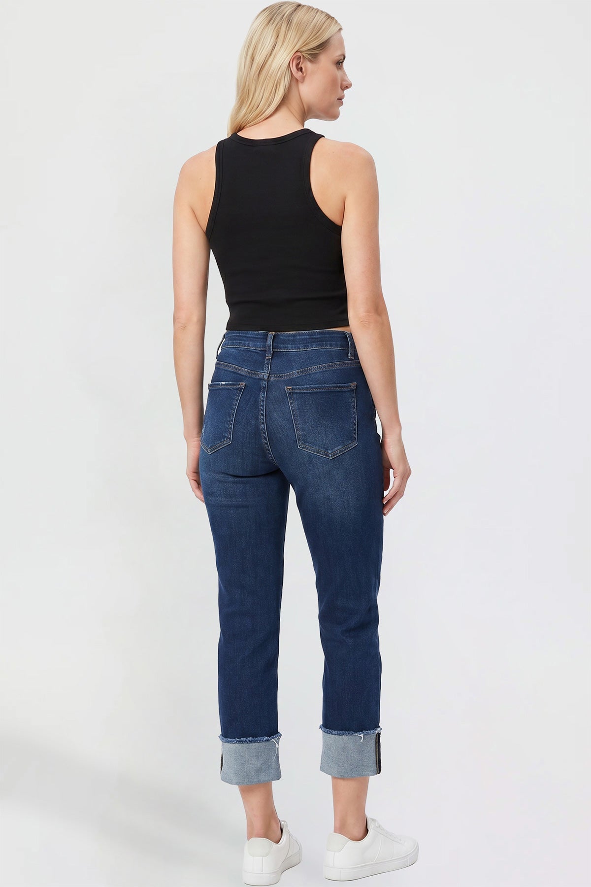 Model wearing YMI JEANS Women's Cropped Mega Cuff Jeans, demonstrating the fashion-forward style and fit.