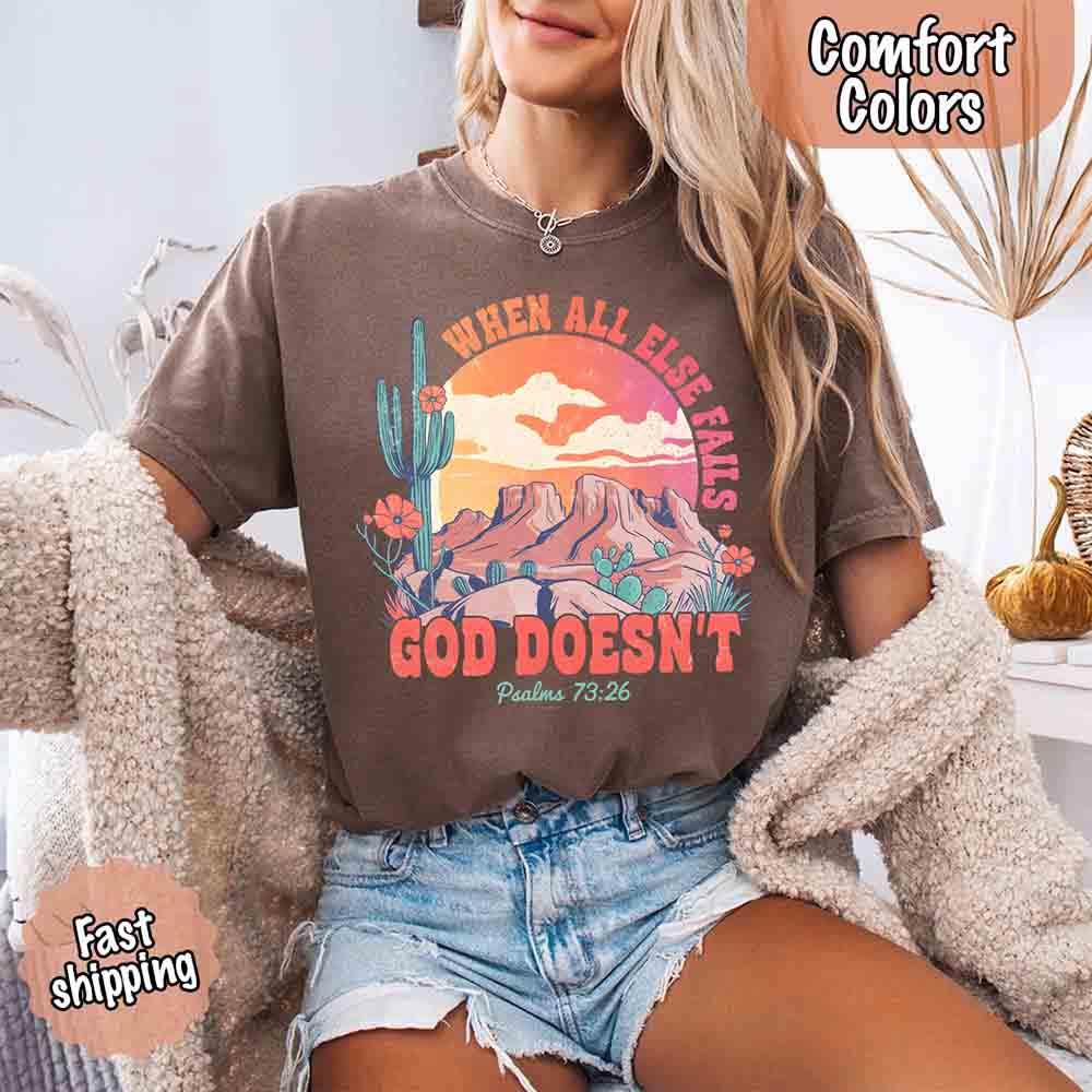 Adorb Custom Tees Comfort Colors faith t-shirt, "When All Else Fails God Doesn't" design, worn by a person, highlighting its 