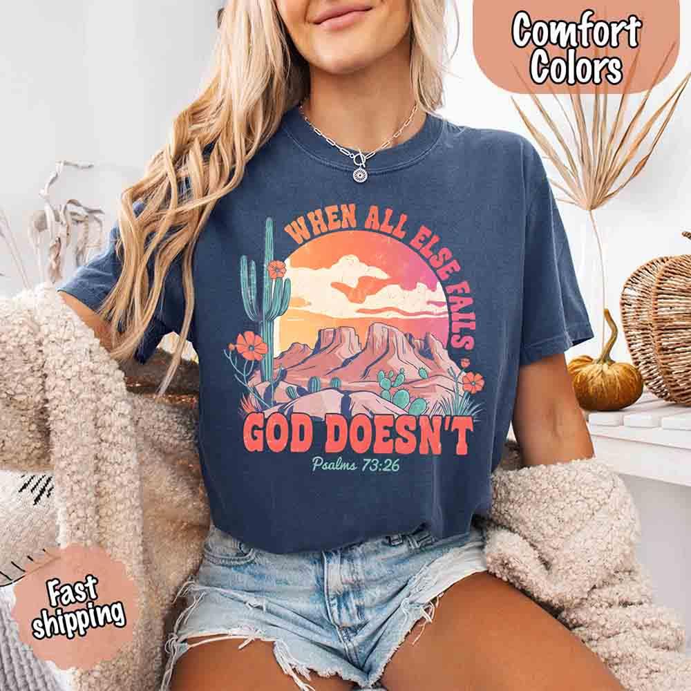 Adorb Custom Tees "When All Else Fails God Doesn't" t-shirt laid flat, showcasing its versatile style and the comforting spir