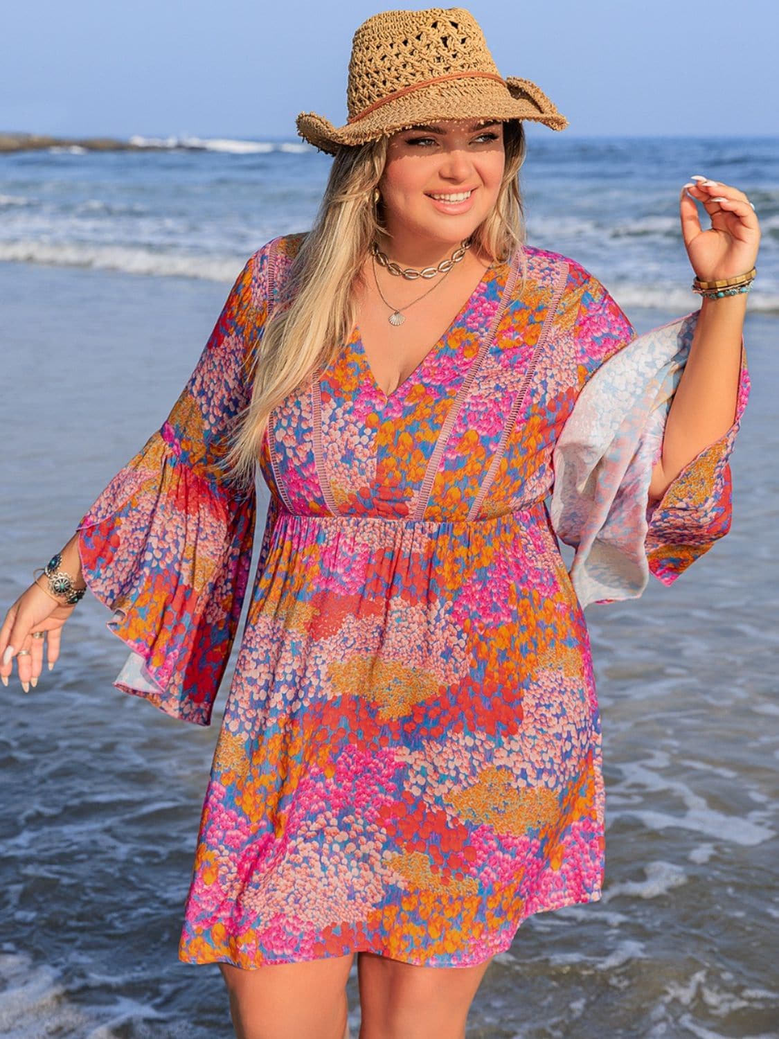 Plus Size Ruched Printed Long Sleeve Dress.