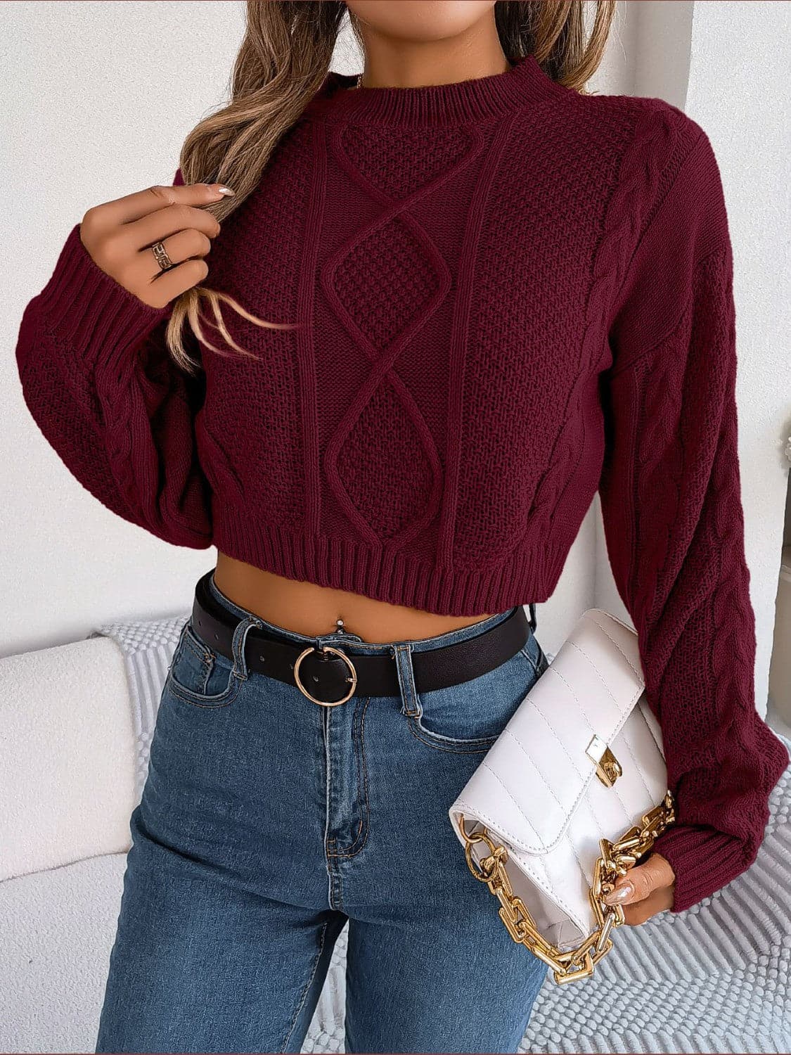 Cable-Knit Round Neck Cropped Sweater.