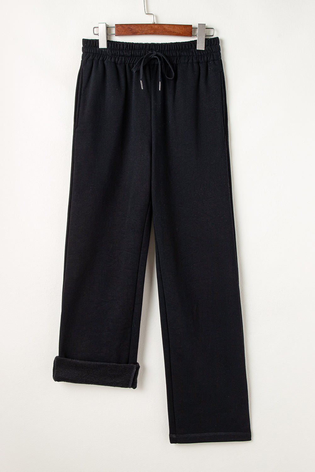 Cozy black fleece-lined casual pants with adjustable drawstring waist