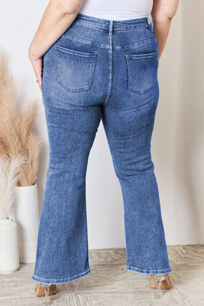 Stylish blue high-waist plus size flare jeans with exposed seam detail