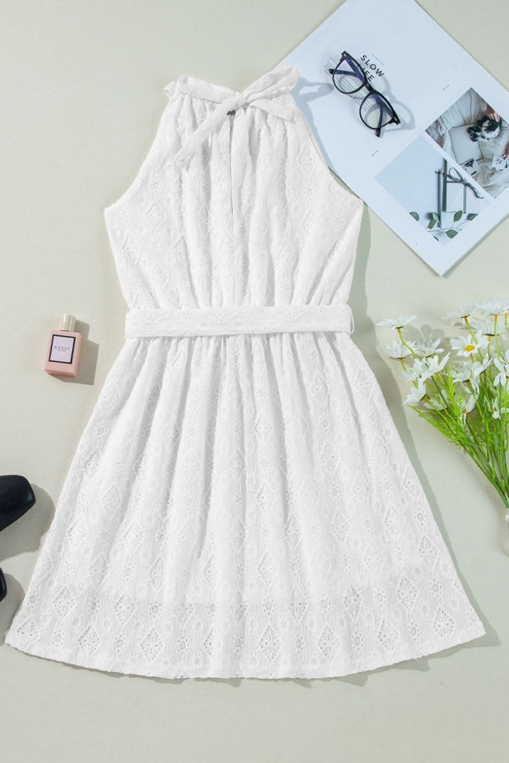 Elegant White Lace Mini Dress with Sleeveless Design and Back Knot Detail