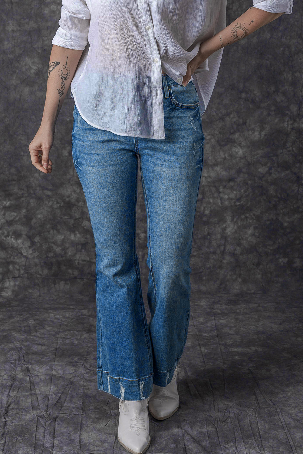 Chic light blue distressed flare jeans for a trendy look