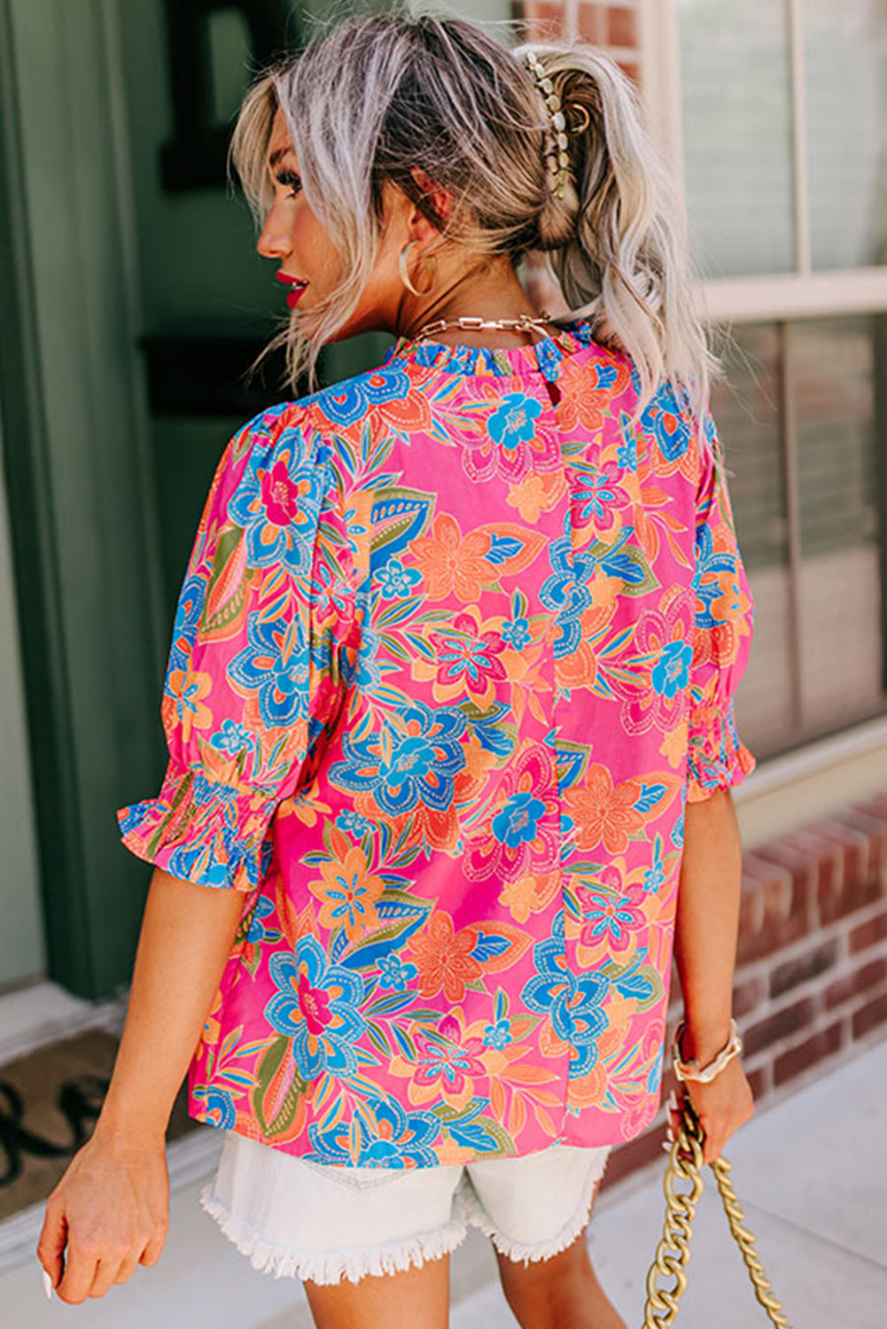 Chic floral print blouse with frilly neck and puff sleeves