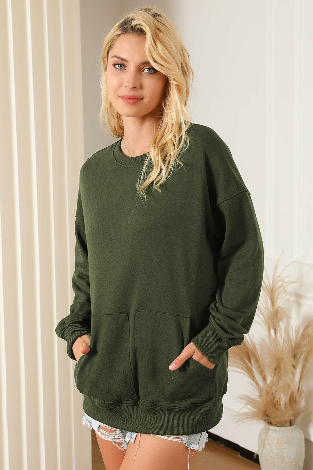 Pocketed Round Neck Dropped Shoulder Sweatshirt.