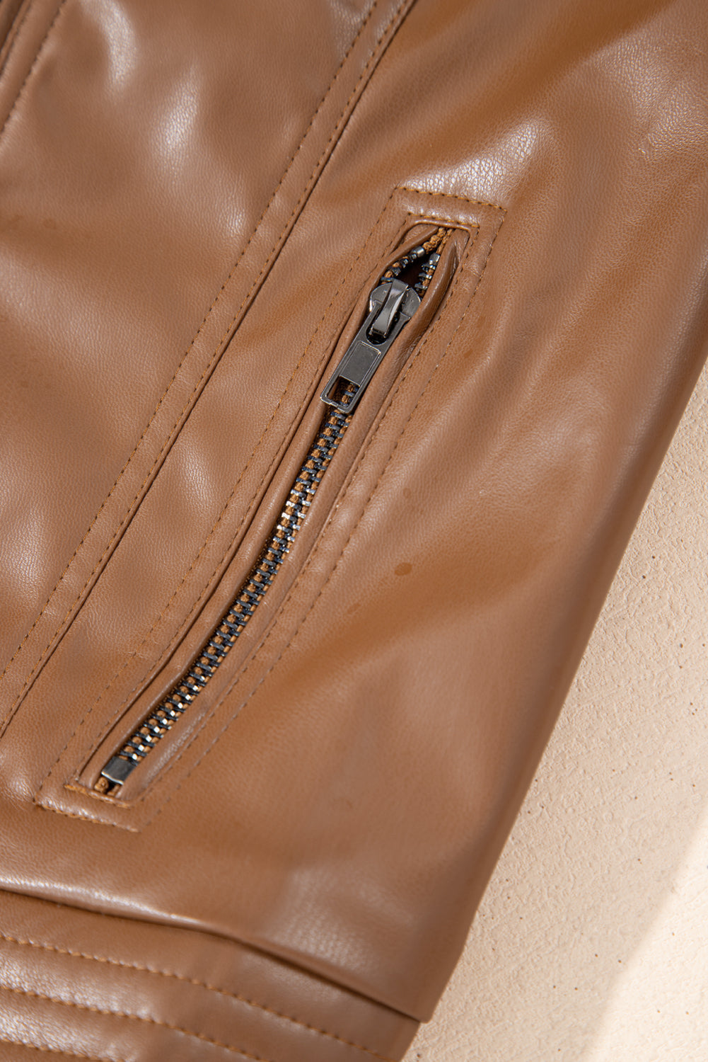 Chic chestnut faux leather bomber jacket with zipper details