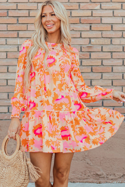 Eye-catching orange abstract smocked mini dress with ruffled lantern sleeves