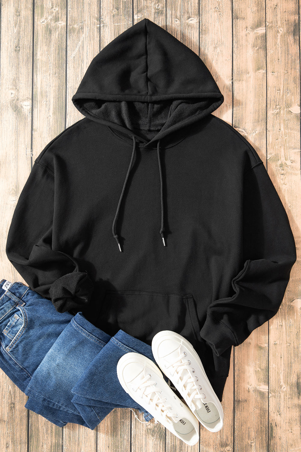 Cozy black fleece-lined hoodie with kangaroo pocket and drawstring design