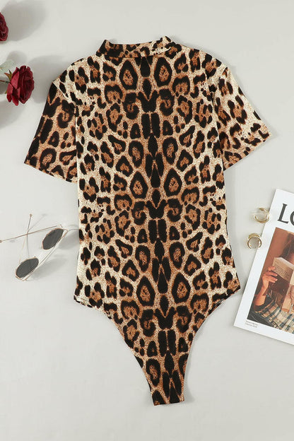 Leopard Half Zip Short Sleeve Bodysuit.