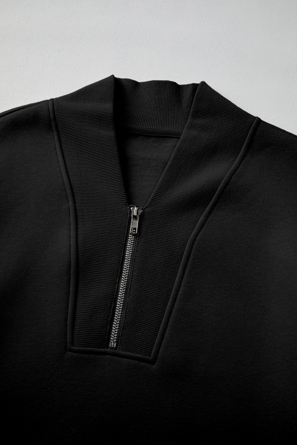 Chic black half zip tracksuit with ribbed edges for ultimate comfort