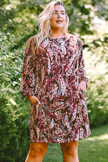 Plus Size Printed Round Neck Long Sleeve Mini Dress.