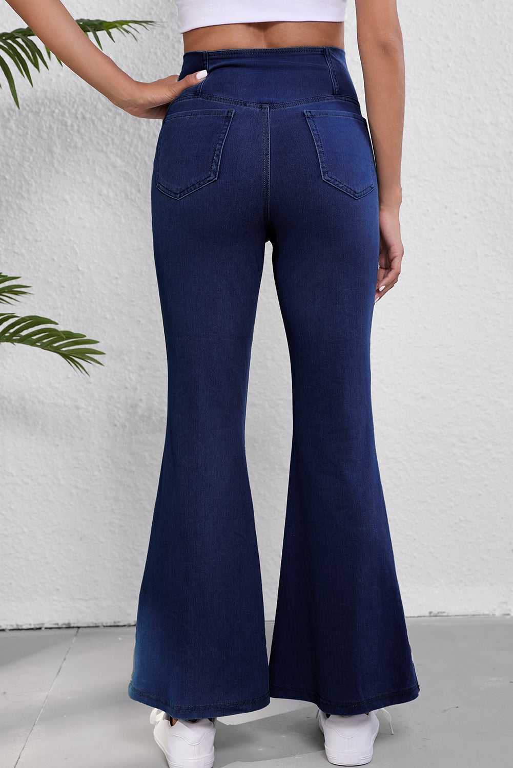 Dusk blue elastic flare jeans with crossed waist design