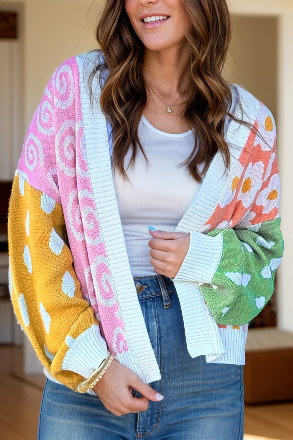 Chic color block cardigan with long sleeves and vibrant patterns.