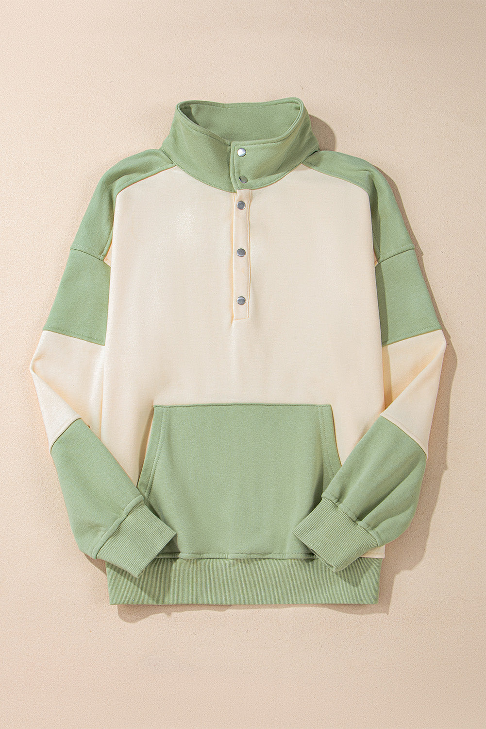 Laurel green colorblock patchwork sweatshirt with buttoned collar and kangaroo pocket