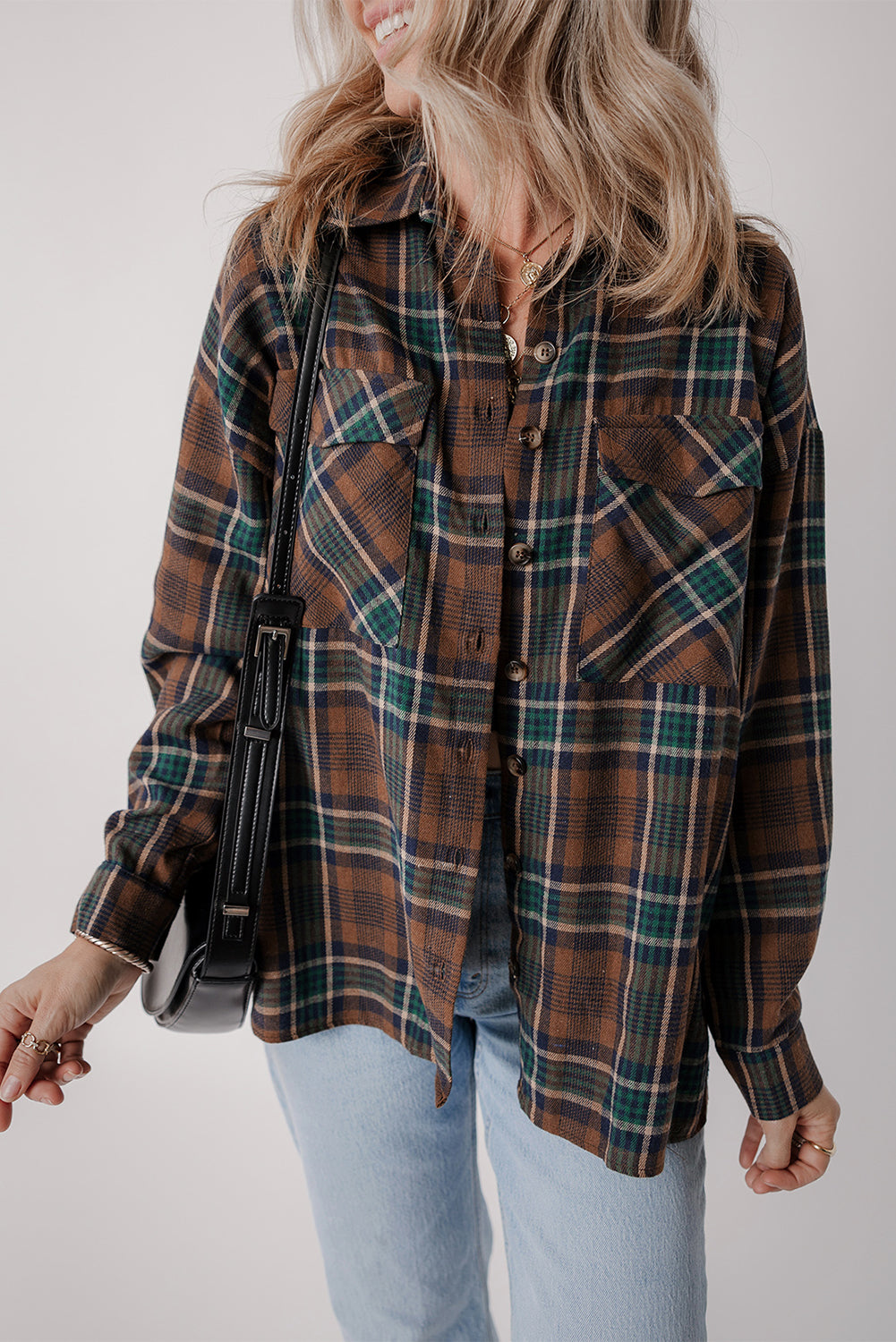 Brown plaid button-up shacket with chest pockets