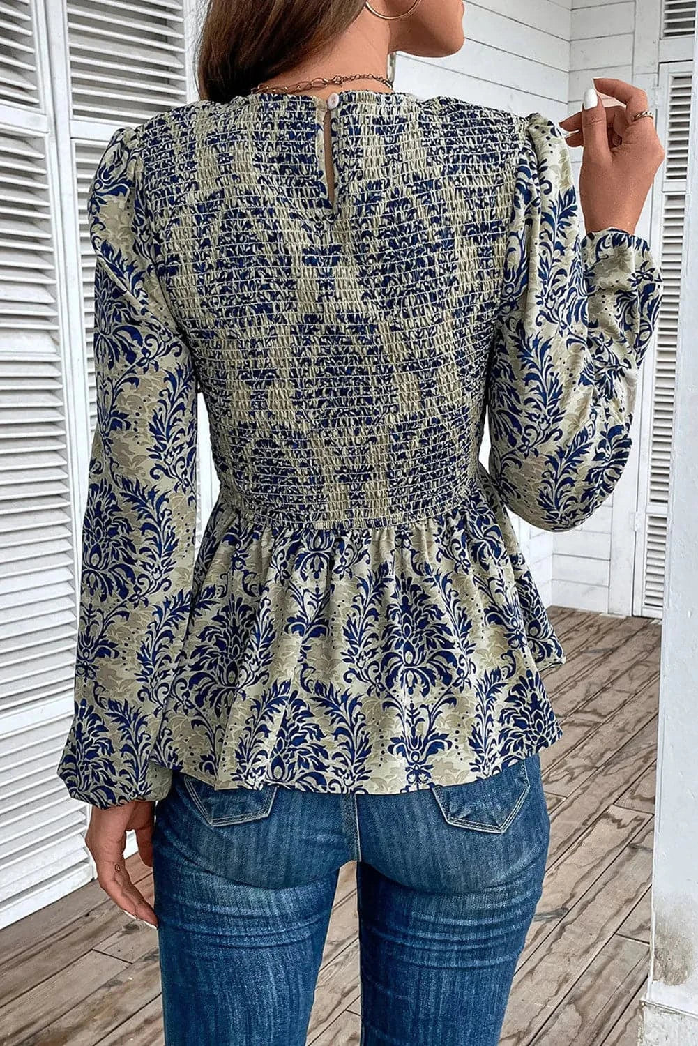 Sheer peplum blouse with print