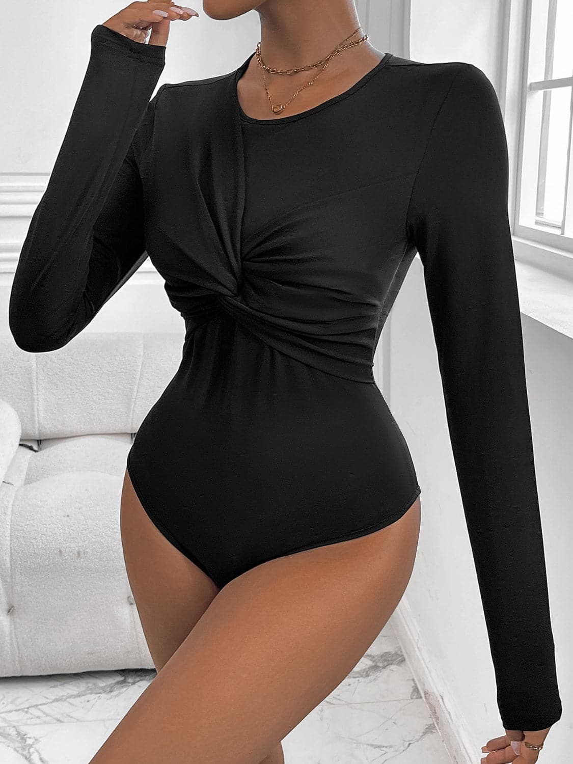 Twisted Round Neck Long Sleeve Bodysuit.