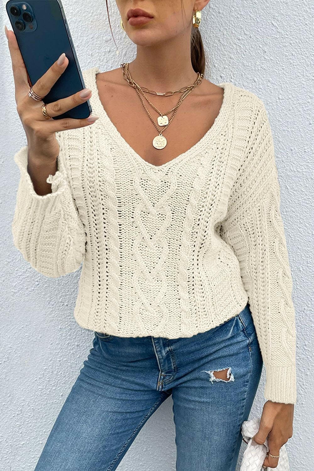 V-Neck Cable-Knit Long Sleeve SweaterV-Neck Cable-Knit Long Sleeve Sweater
 Indulge in cozy sophistication with our V-Neck Cable-Knit Long Sleeve Sweater. Crafted from 100% acrylic with a moderate stretLove Salve -Neck Cable-Knit Long Sleeve Sweatercloseout