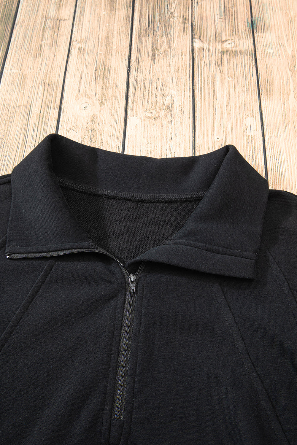 Chic black quarter zip sweatshirt with kangaroo pocket