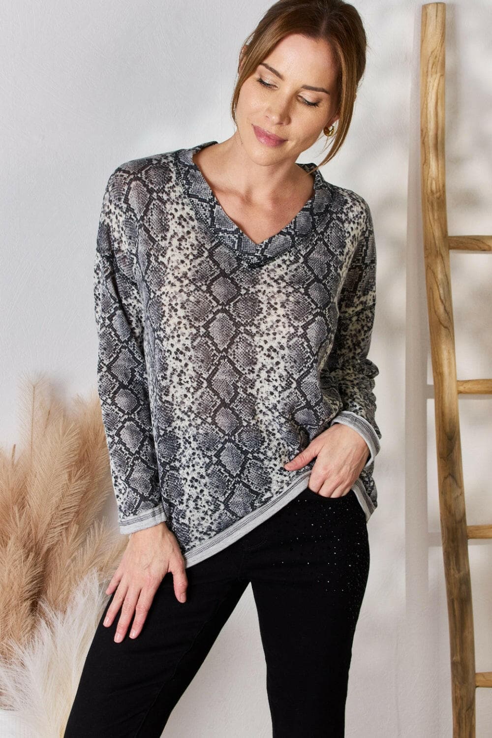 Hailey & Co Full Size Snakeskin V-Neck Long Sleeve TopStep Into the Spotlight with Hailey &amp; Co
 Embrace your boldness and stay on trend with the Hailey &amp; Co Full Size Snakeskin V-Neck Long Sleeve Top. This stunnLove Salve -Neck Long Sleeve Topcloseout