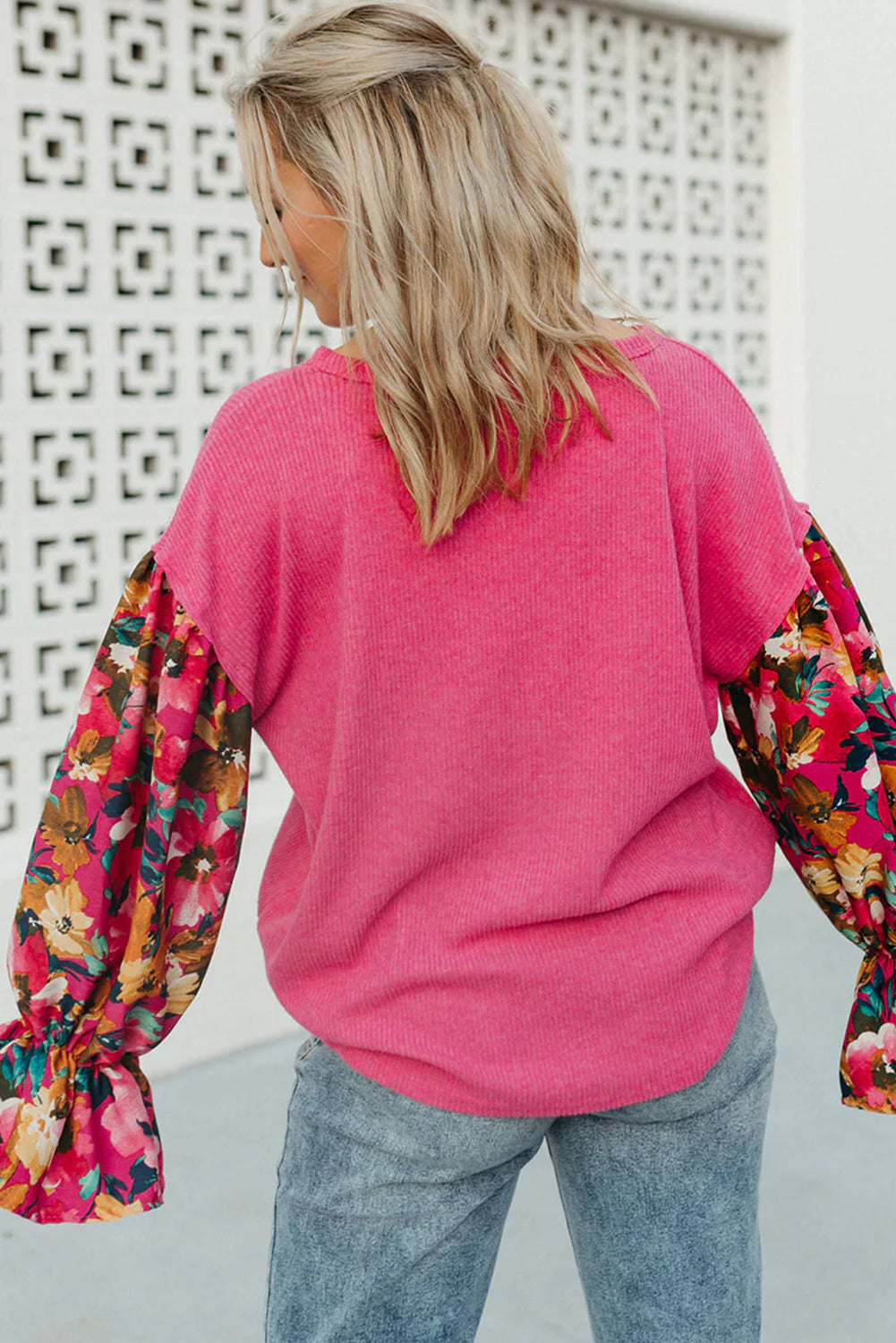 Bright pink floral flounce sleeve plus-size top with ribbed knit comfort