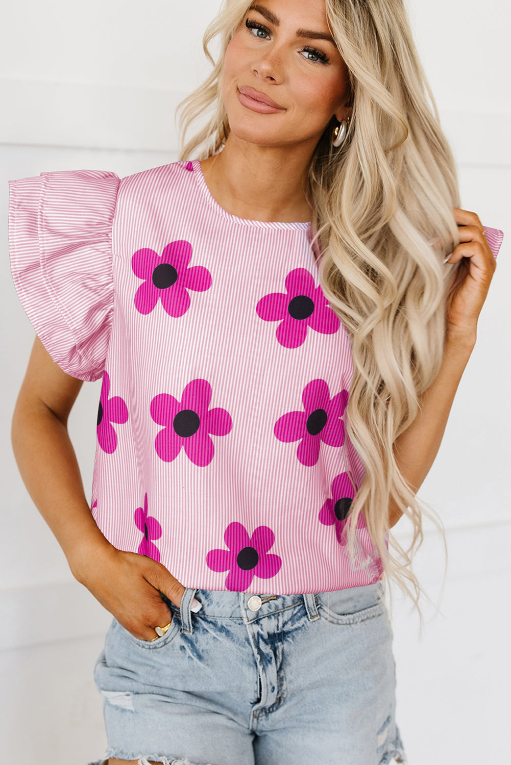 Chic pink pinstripe floral blouse with ruffled flutter sleeves