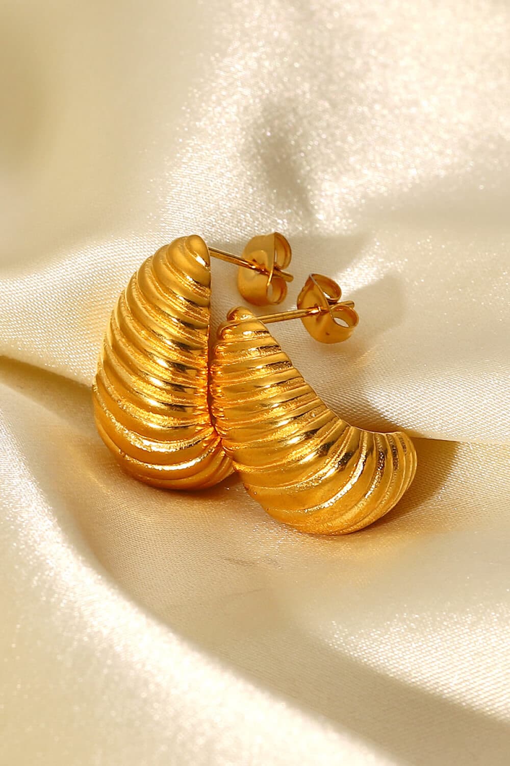 Seashell-inspired spiral stud earrings for elegant charm