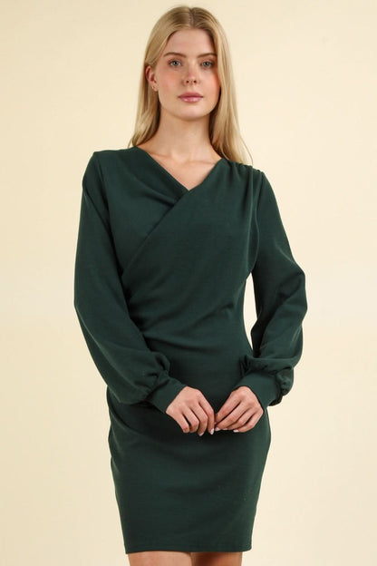 Ruched bodycon dress with sleek silhouette and mini style in dark green.