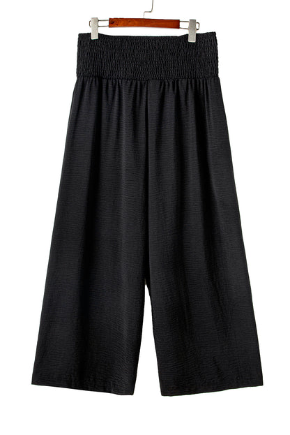 Chic black plus size wide leg pants with shirred high waist