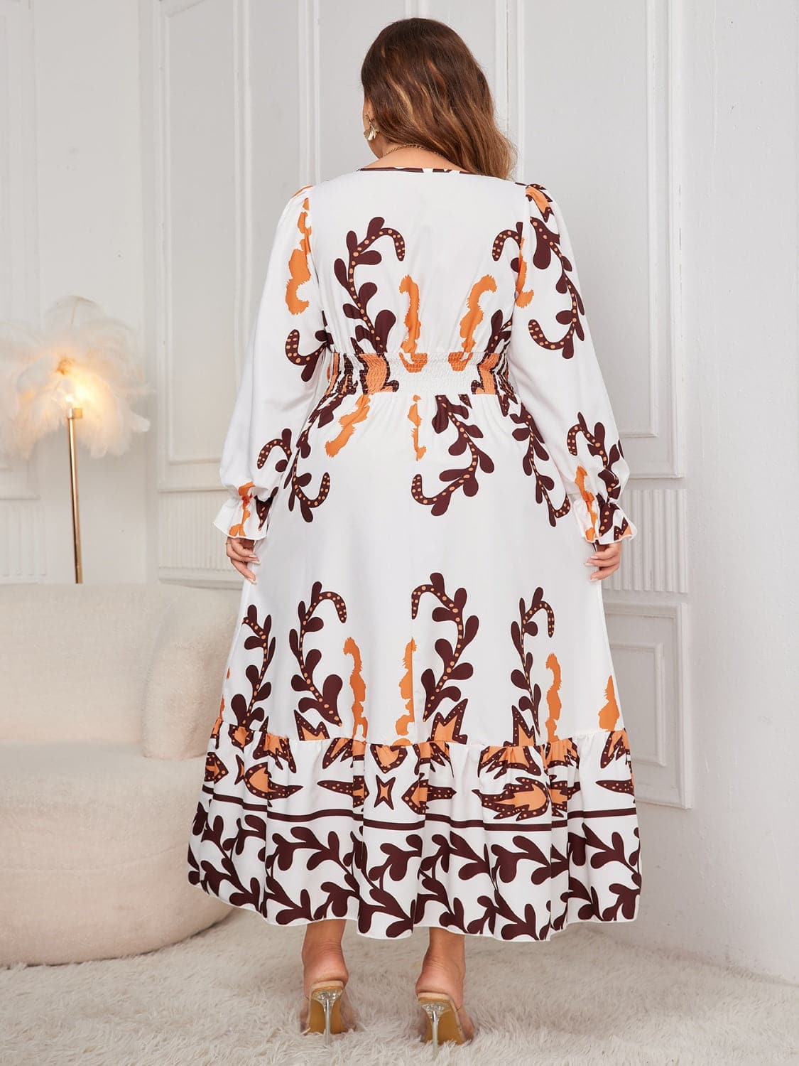 Plus Size Printed Surplice Flounce Sleeve Dress.