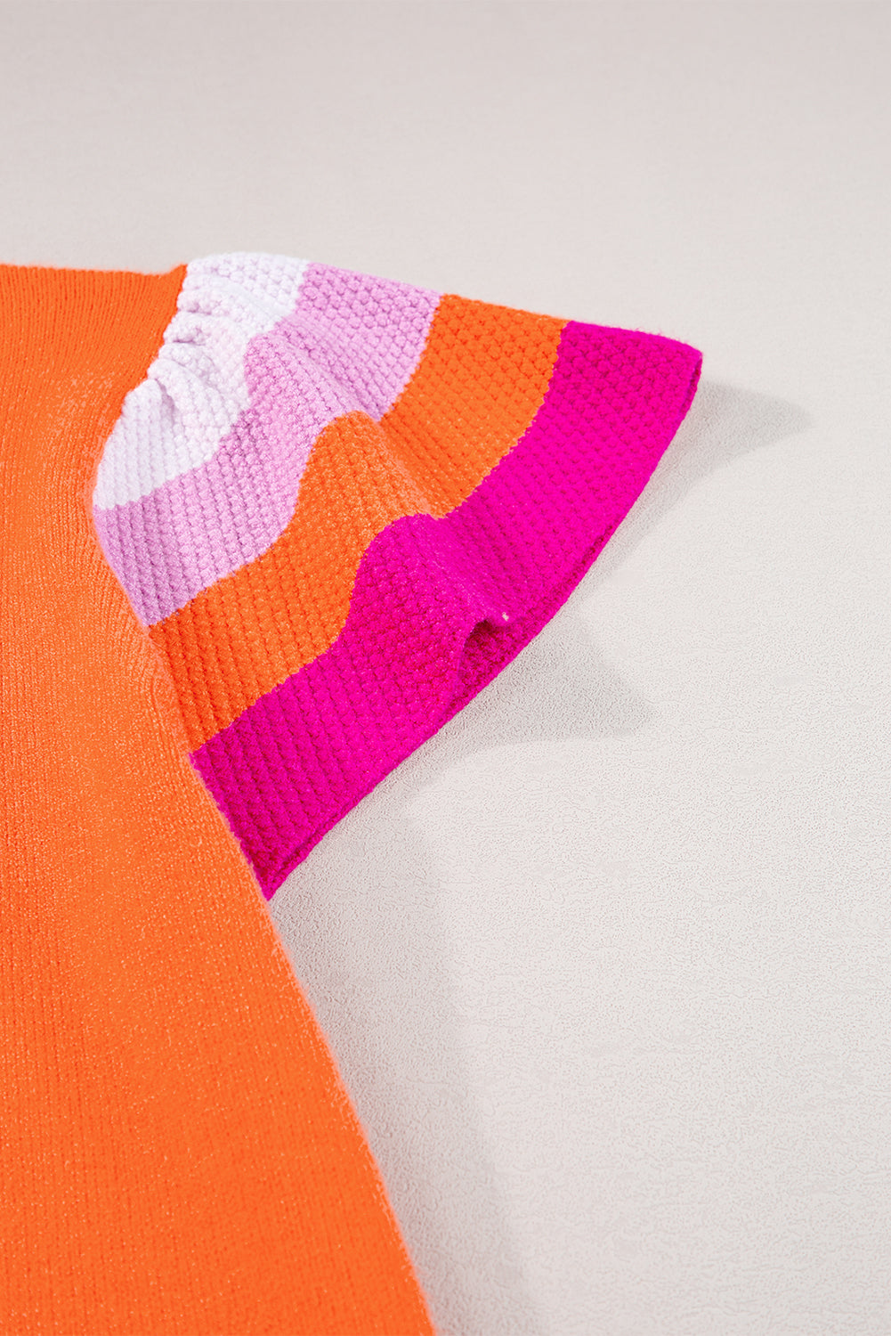 Carrot color block knitted sweater with flutter sleeves