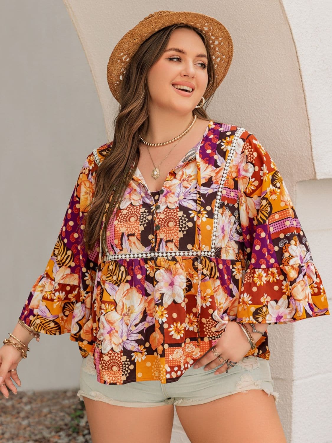 Plus Size Printed Tie Neck Blouse.