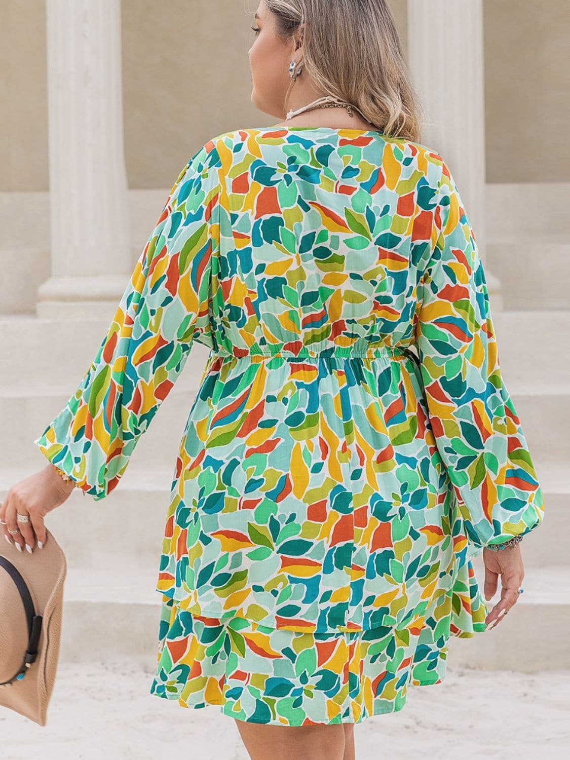 Plus Size Printed Surplice Long Sleeve Mini Dress.