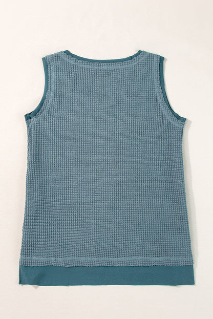 Teal flowy vest with scoop neckline and waffle knit texture